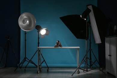 Photo of Shooting of men's shoes for product promotion in photo studio