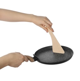 Photo of Woman with spatula and frying pan on white background, closeup