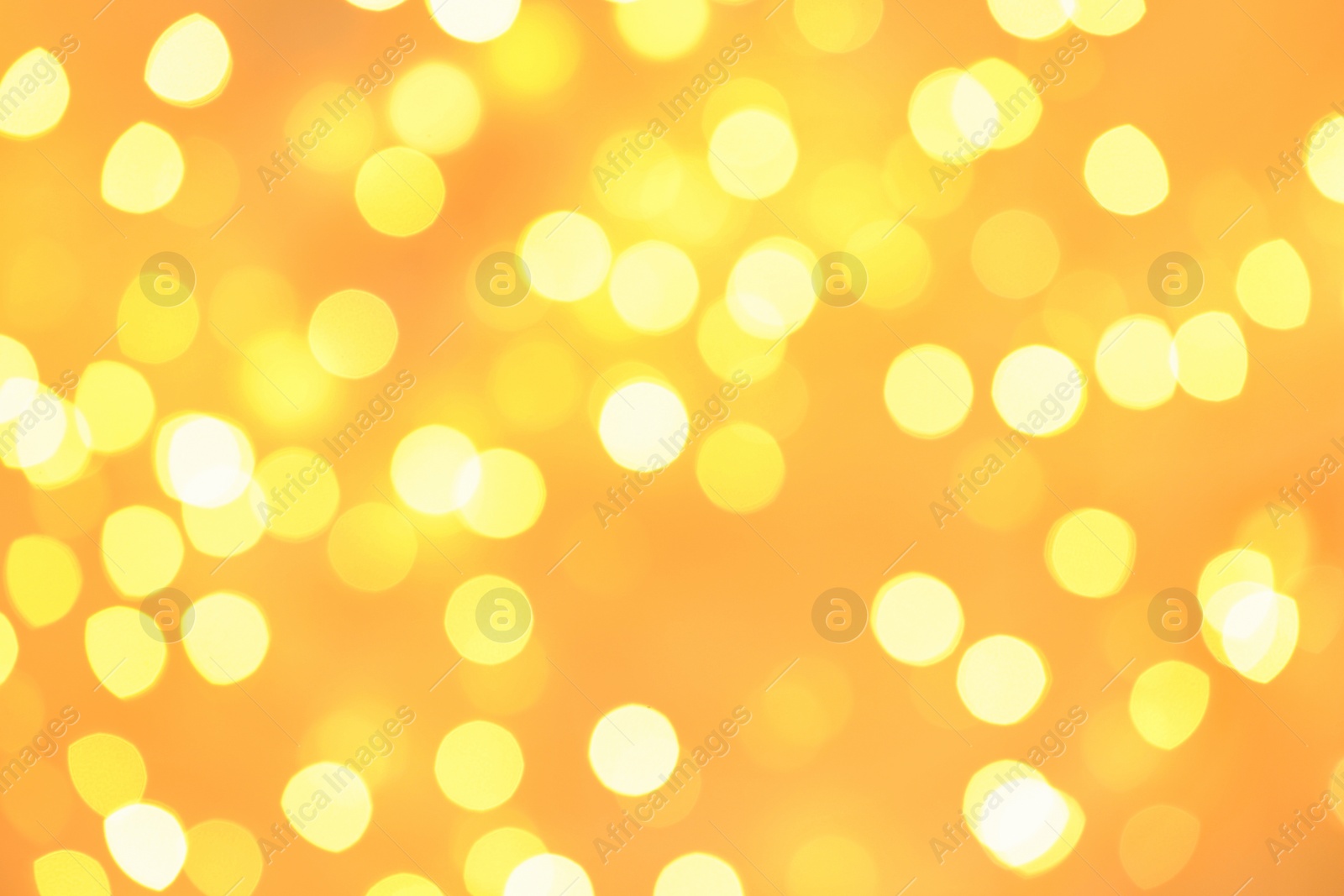 Photo of Beautiful golden lights as background. Bokeh effect