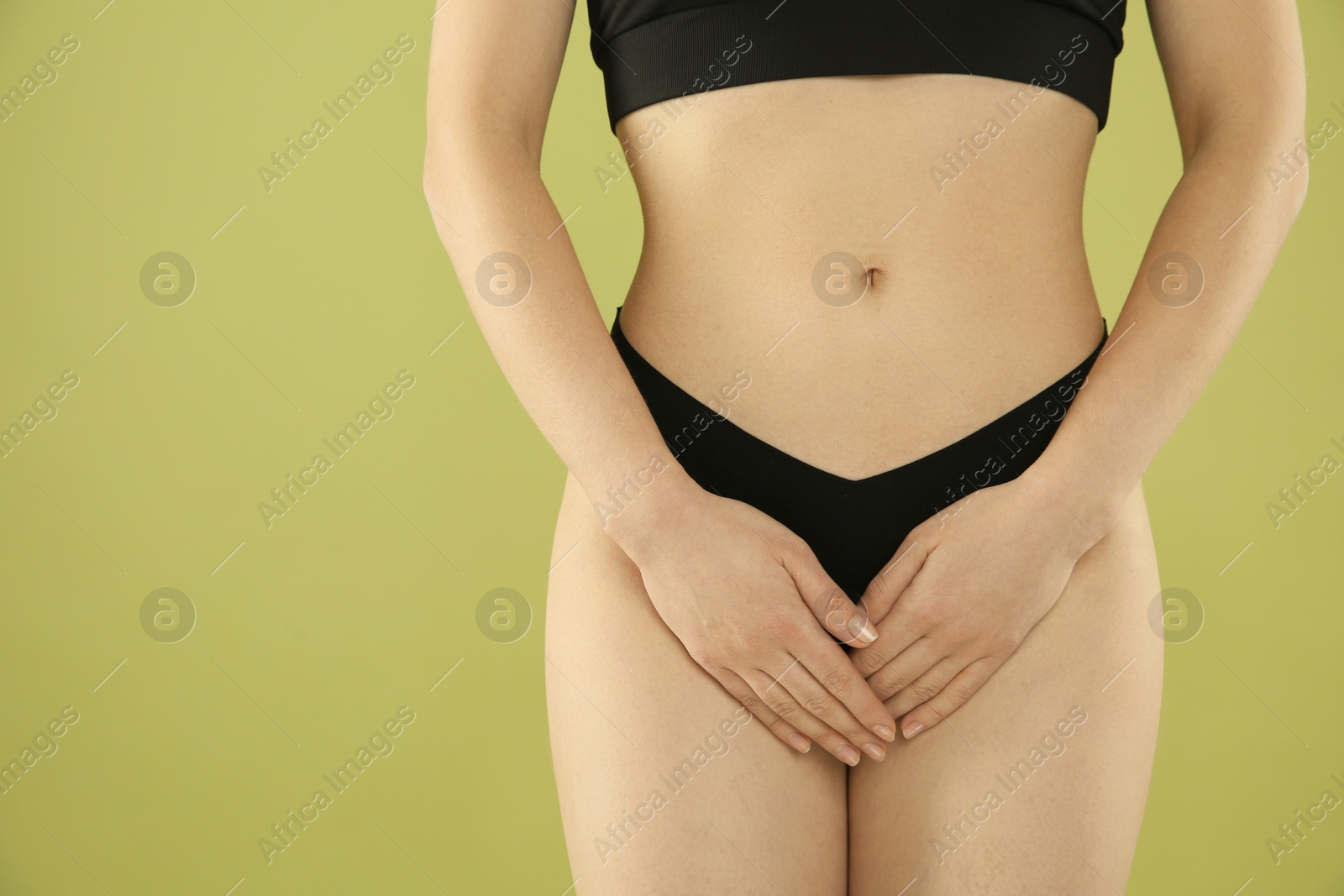 Photo of Gynecology. Woman in underwear on green background, closeup. Space for text