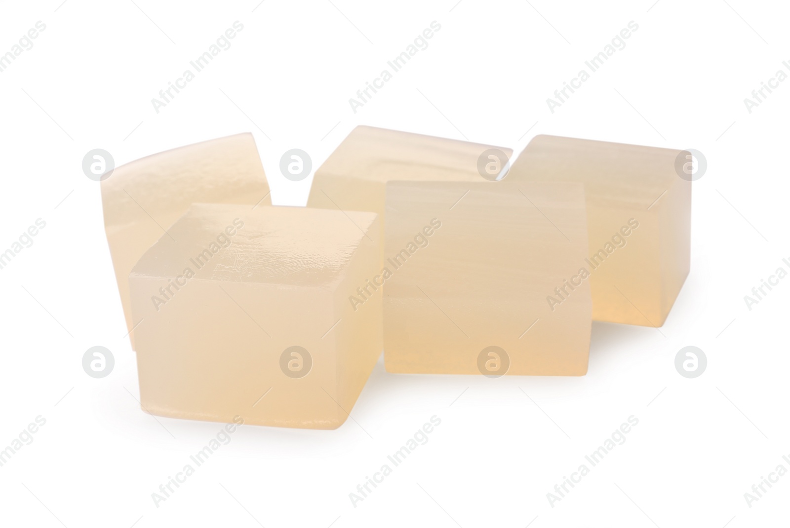 Photo of Many agar-agar jelly cubes on white background