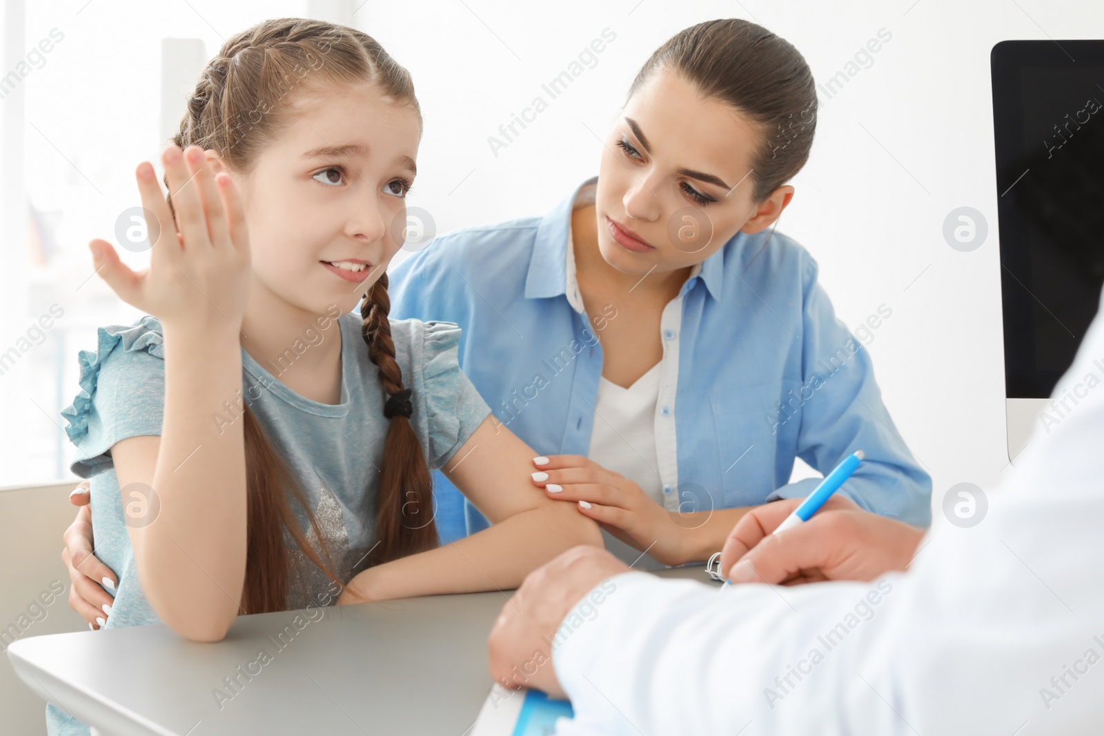 Photo of Young woman with her daughter having appointment at child psychologist office