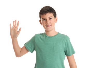 Photo of Happy teenage boy waving to say hello on white background
