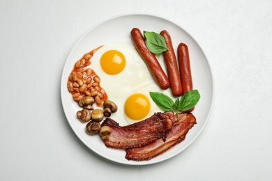 Photo of Traditional English breakfast with fried eggs on white table, top view