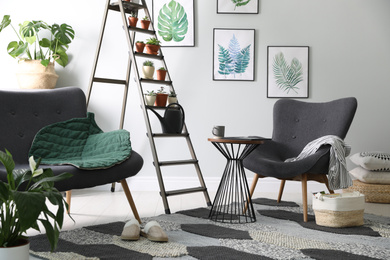 Stylish living room interior with decorative ladder