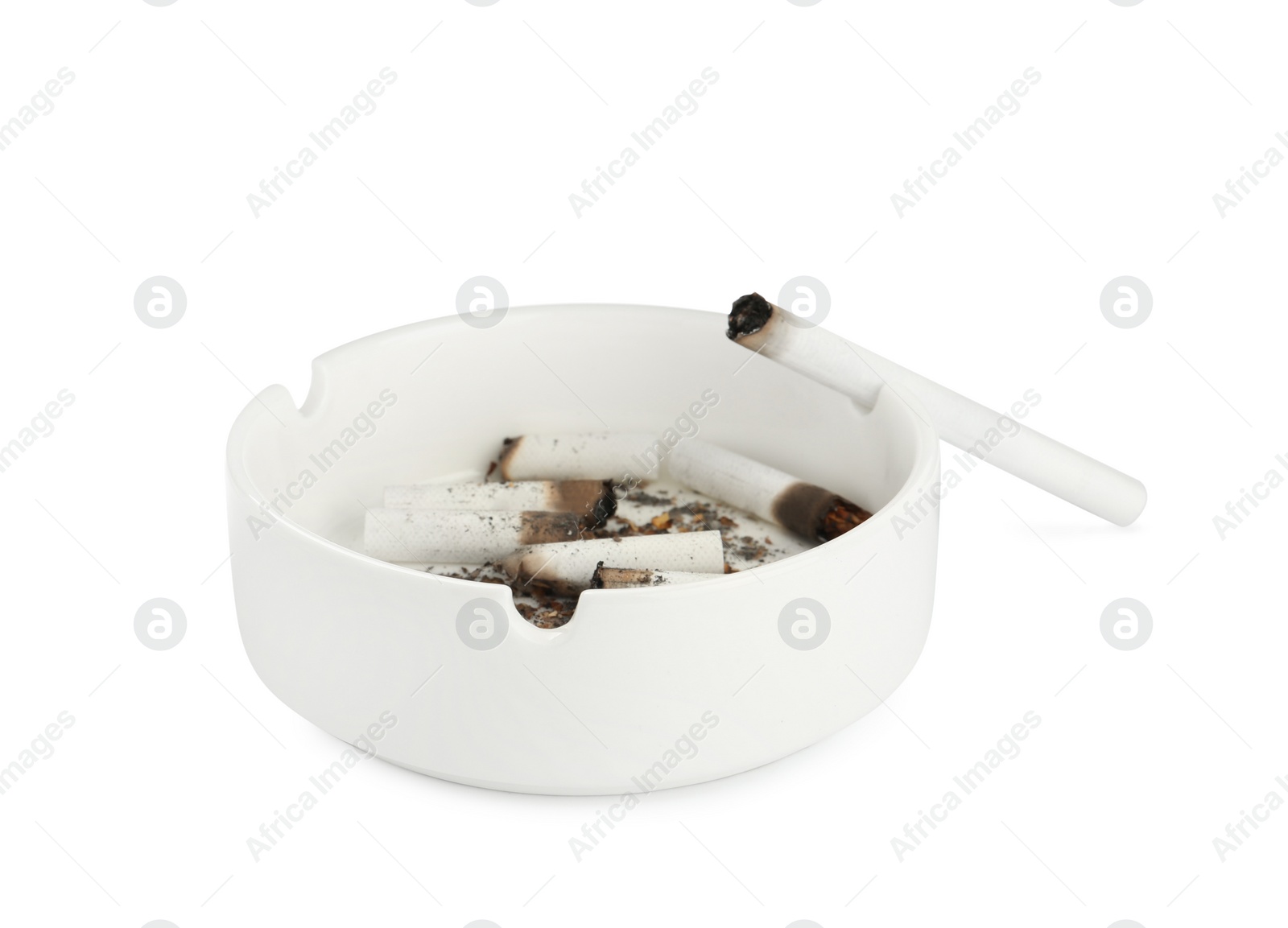 Photo of Ceramic ashtray with cigarette stubs isolated on white