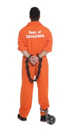 Photo of Prisoner in jumpsuit with chained hands and metal ball on white background, back view