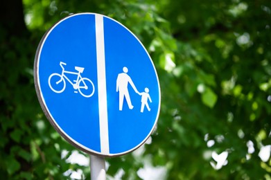 Photo of Traffic sign Compulsory Pedestrian Track and Bicycles outdoors, space for text