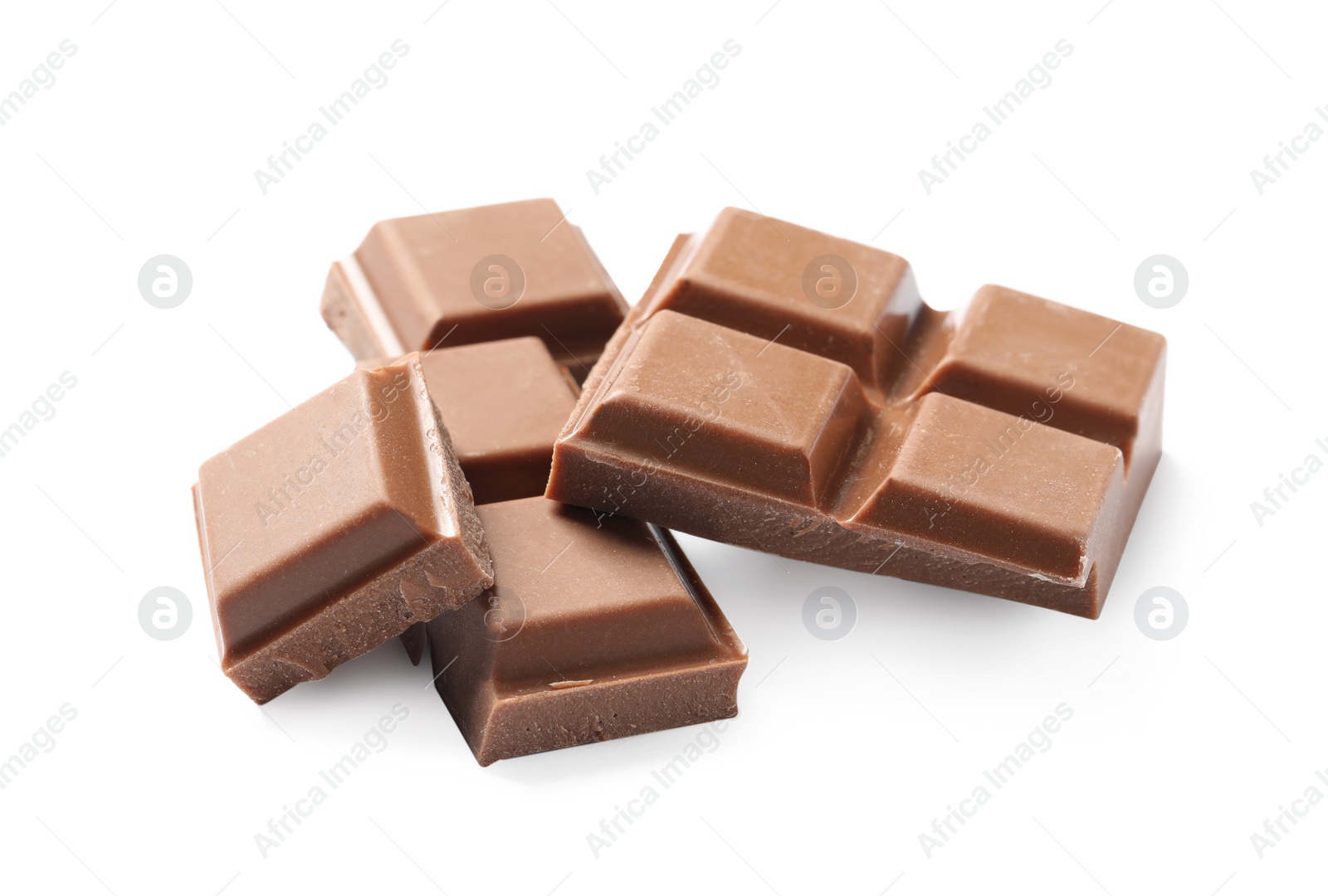 Photo of Pieces of delicious milk chocolate isolated on white