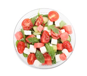 Photo of Delicious salad with watermelon, vegetables and feta cheese isolated on white, top view