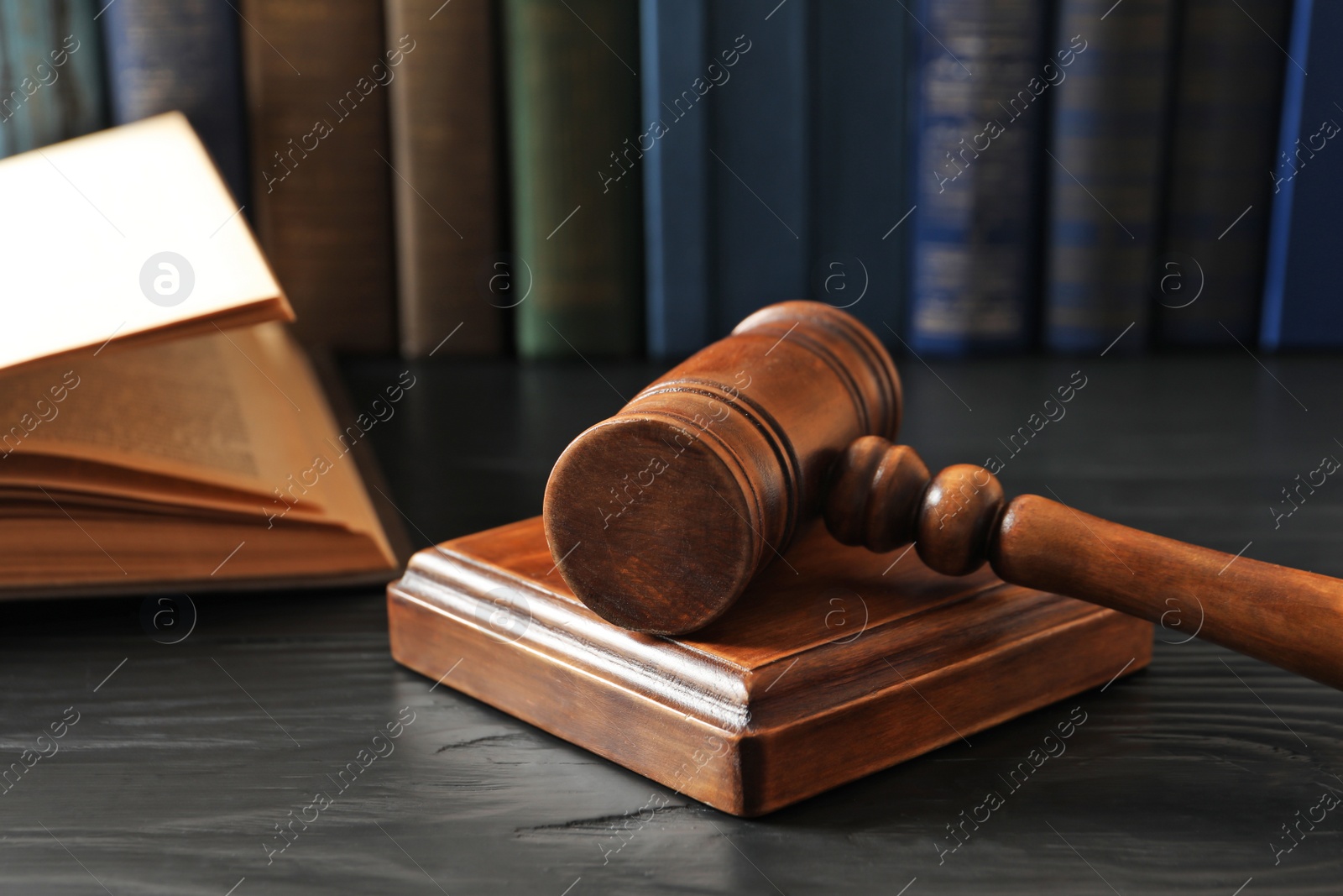 Photo of Wooden gavel and books on table. Law concept