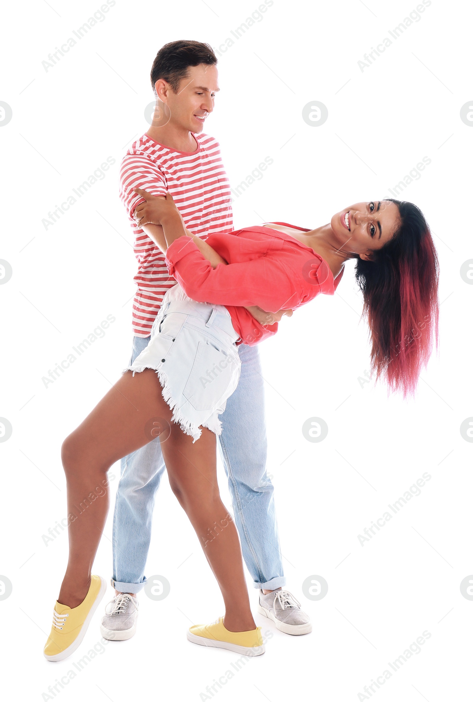 Photo of Beautiful lovely couple dancing on white background