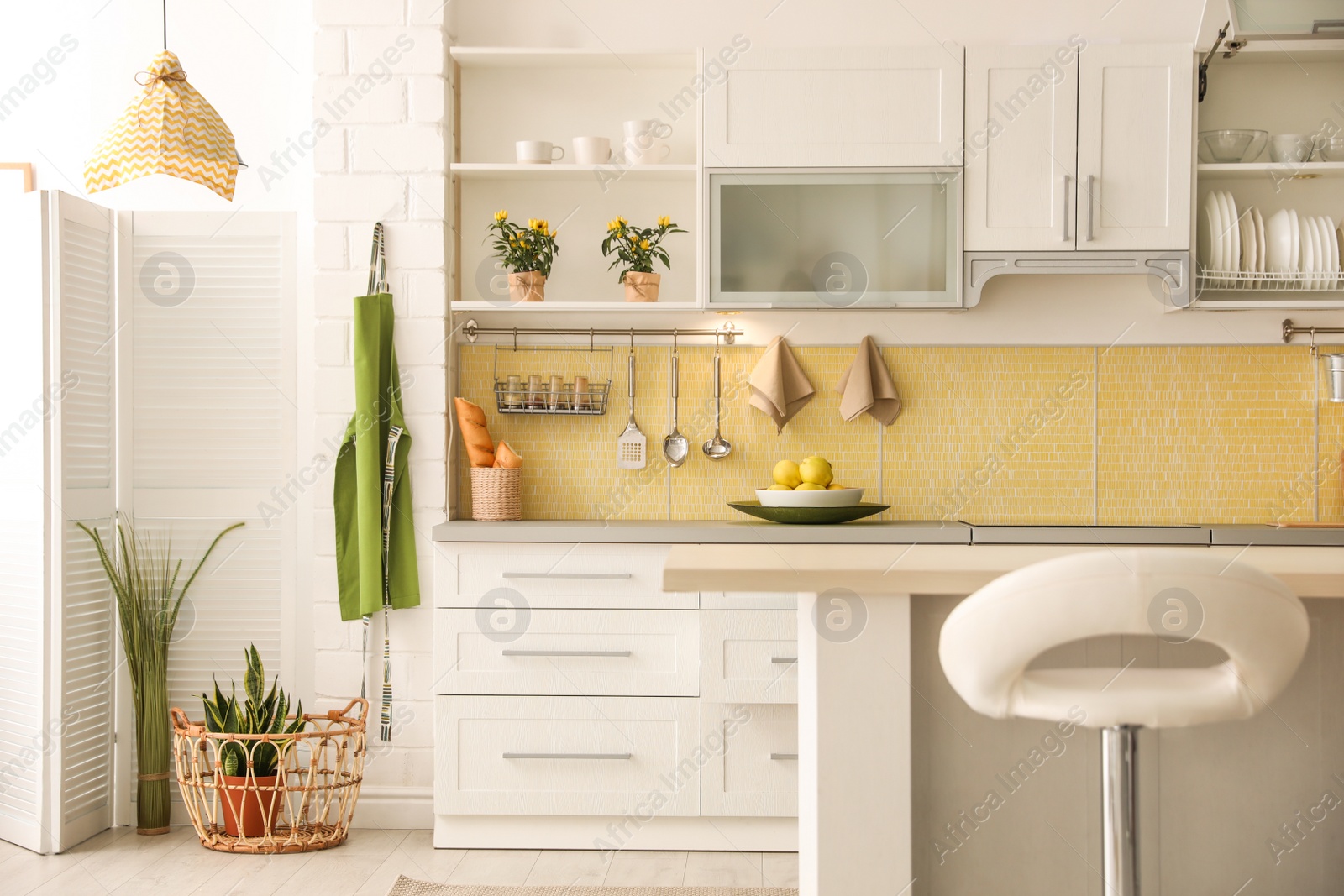 Photo of Modern kitchen interior with stylish white furniture