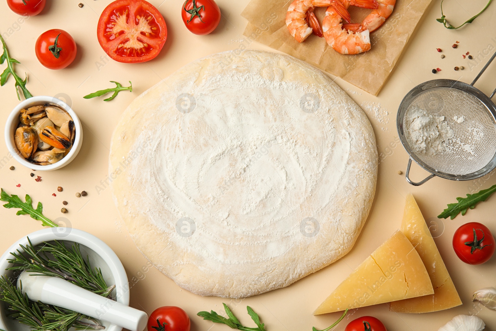 Photo of Flat lay composition with dough and fresh ingredients for seafood pizza on beige background