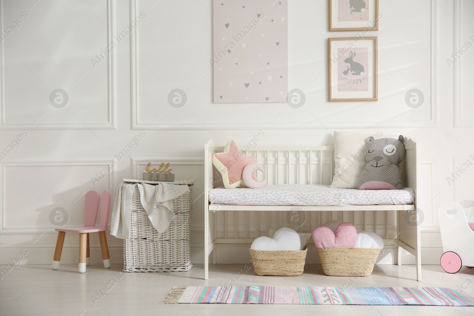 Photo of Baby room interior with stylish furniture and toys