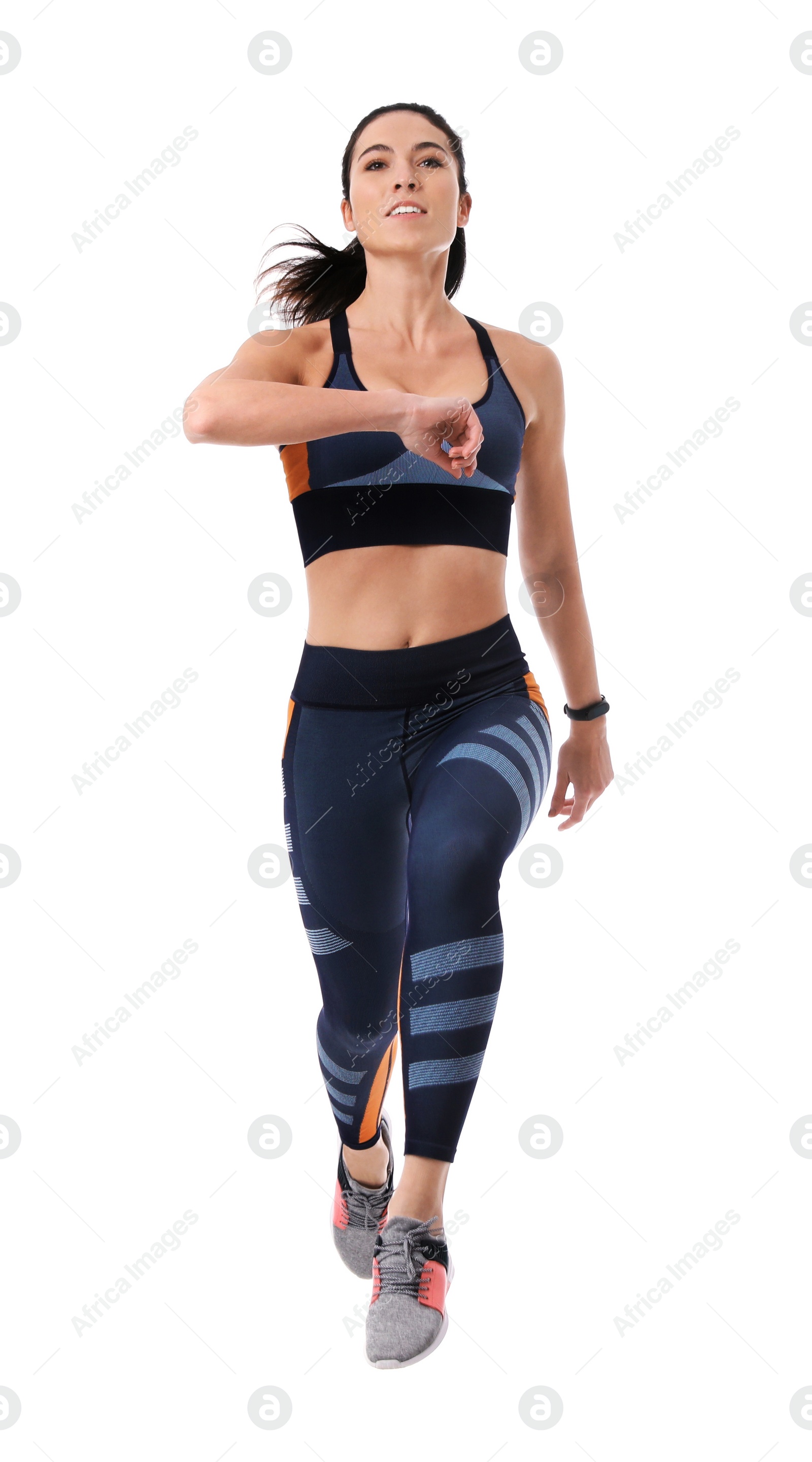 Photo of Athletic young woman running on white background