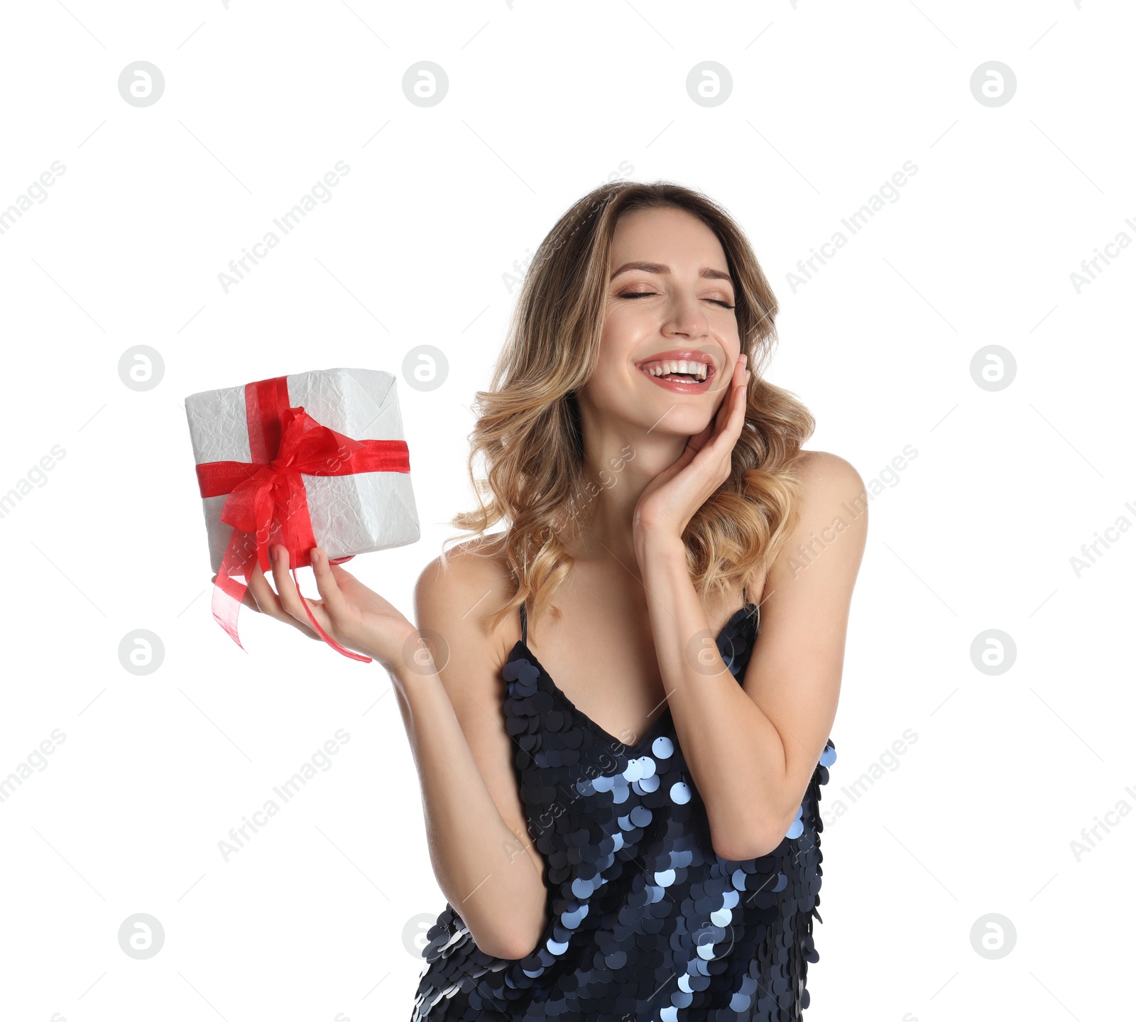 Photo of Beautiful young woman with Christmas present on white background