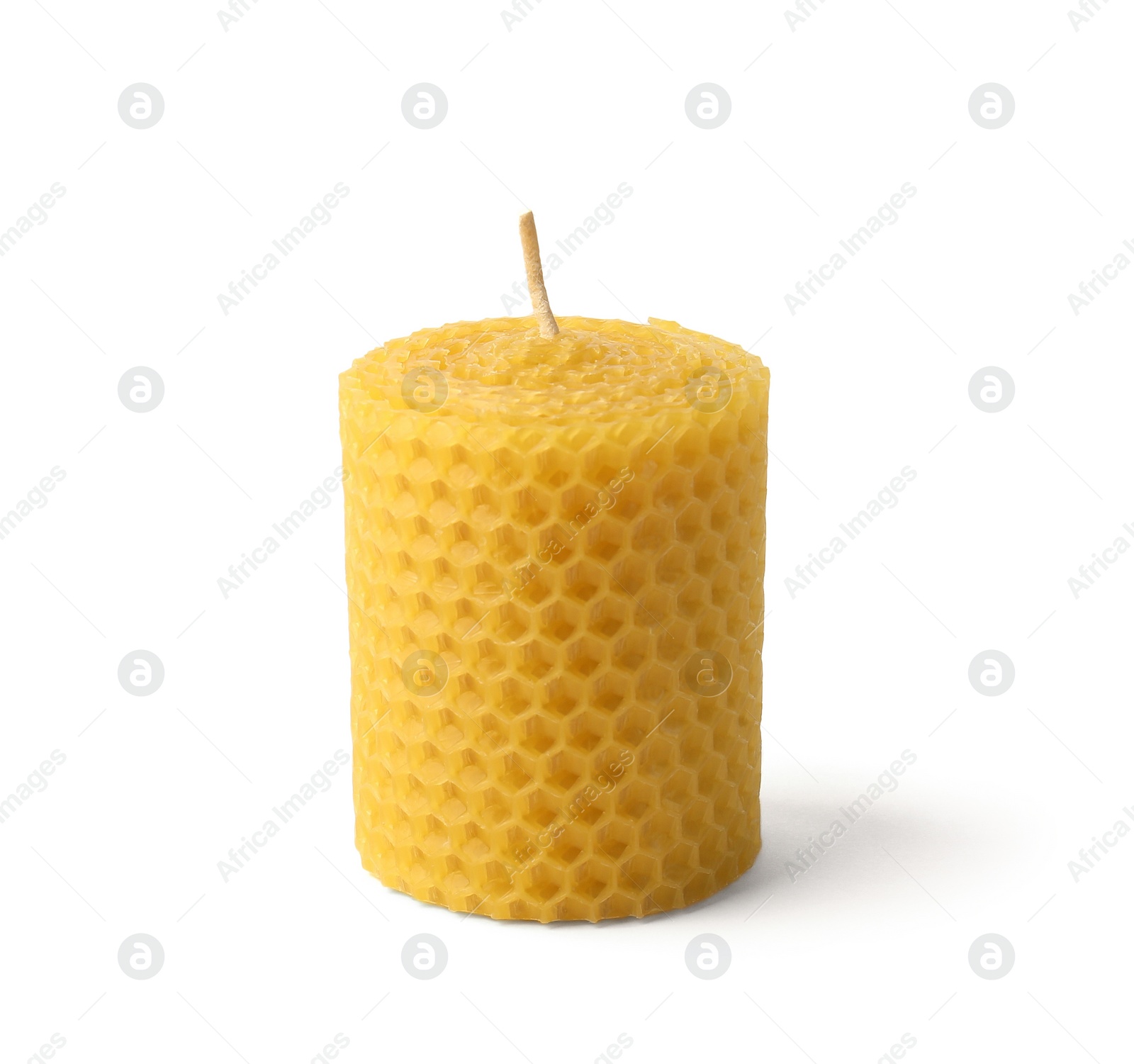 Photo of Stylish elegant beeswax candle isolated on white