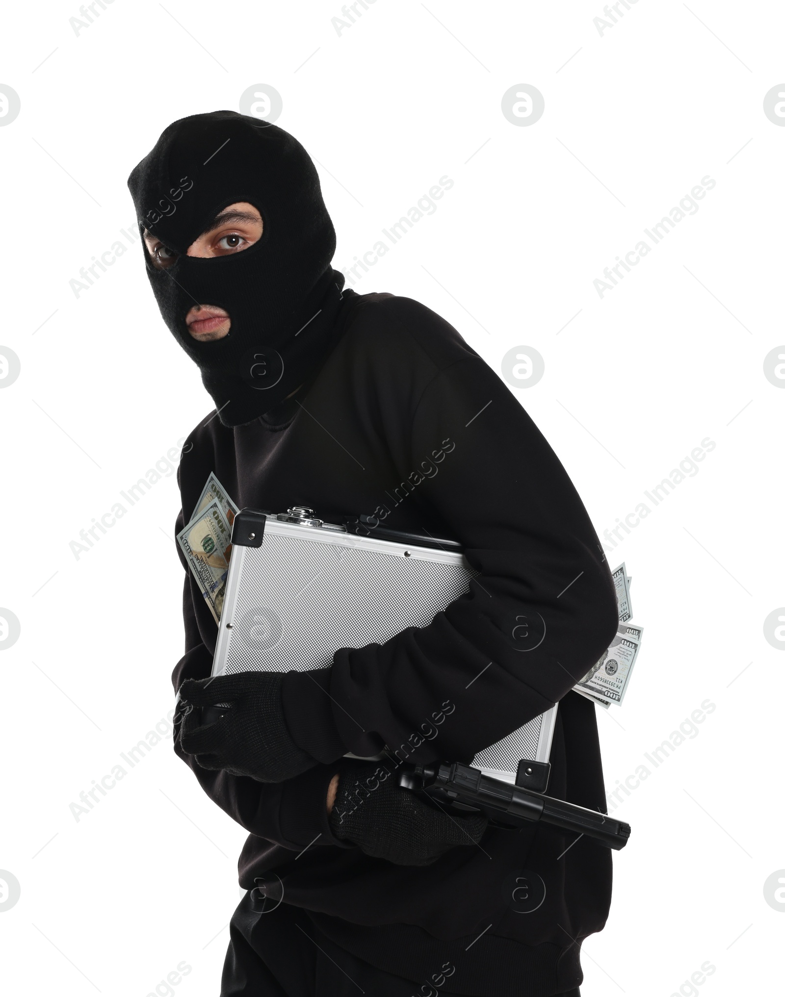 Photo of Thief in balaclava with gun and briefcase of money on white background