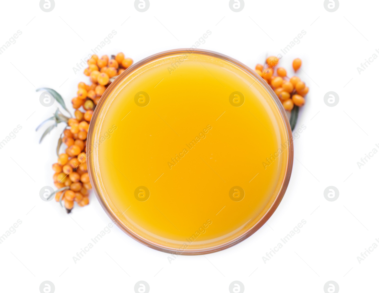 Photo of Delicious sea buckthorn juice and fresh berries isolated on white, top view