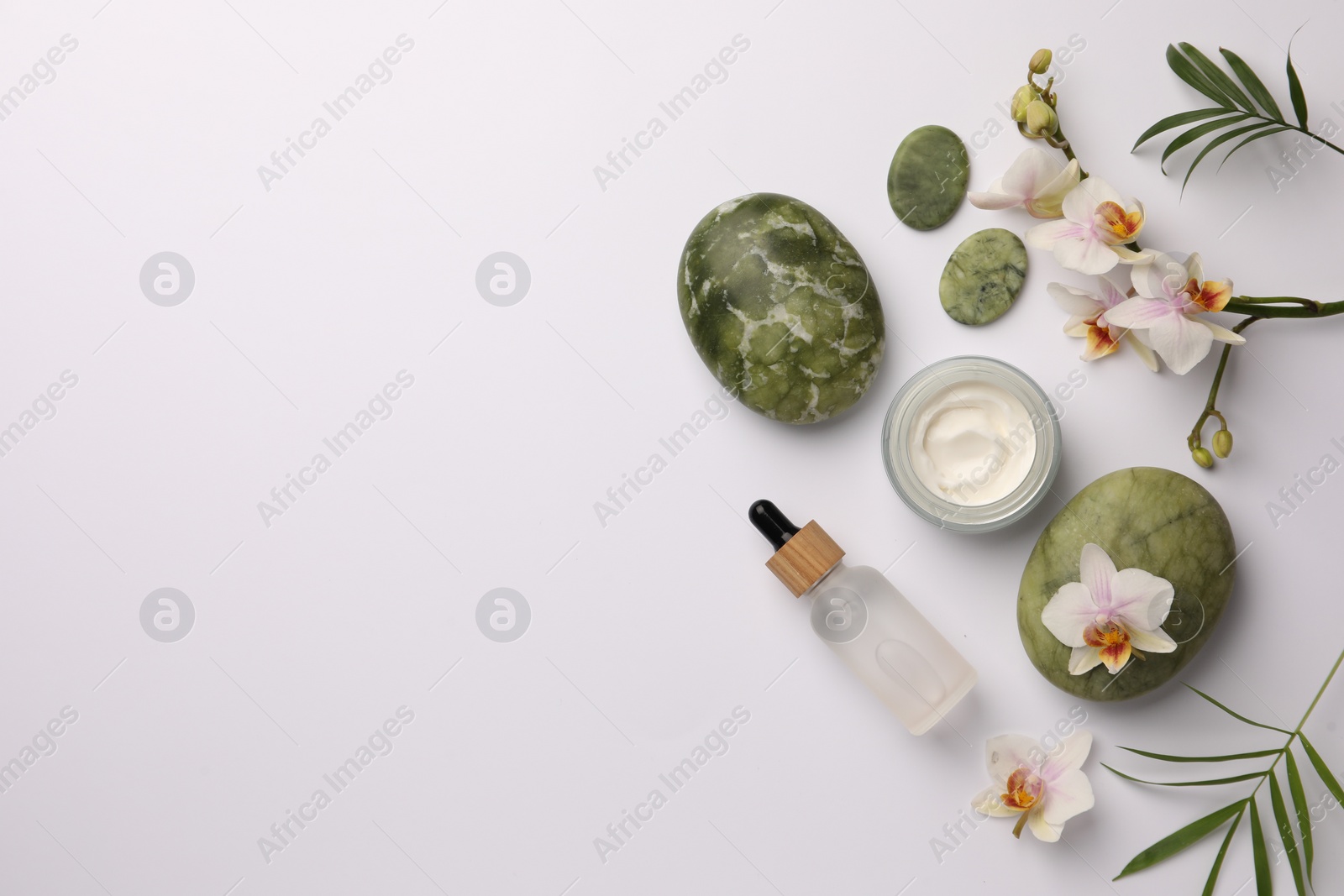 Photo of Flat lay composition with different spa products on white background. Space for text