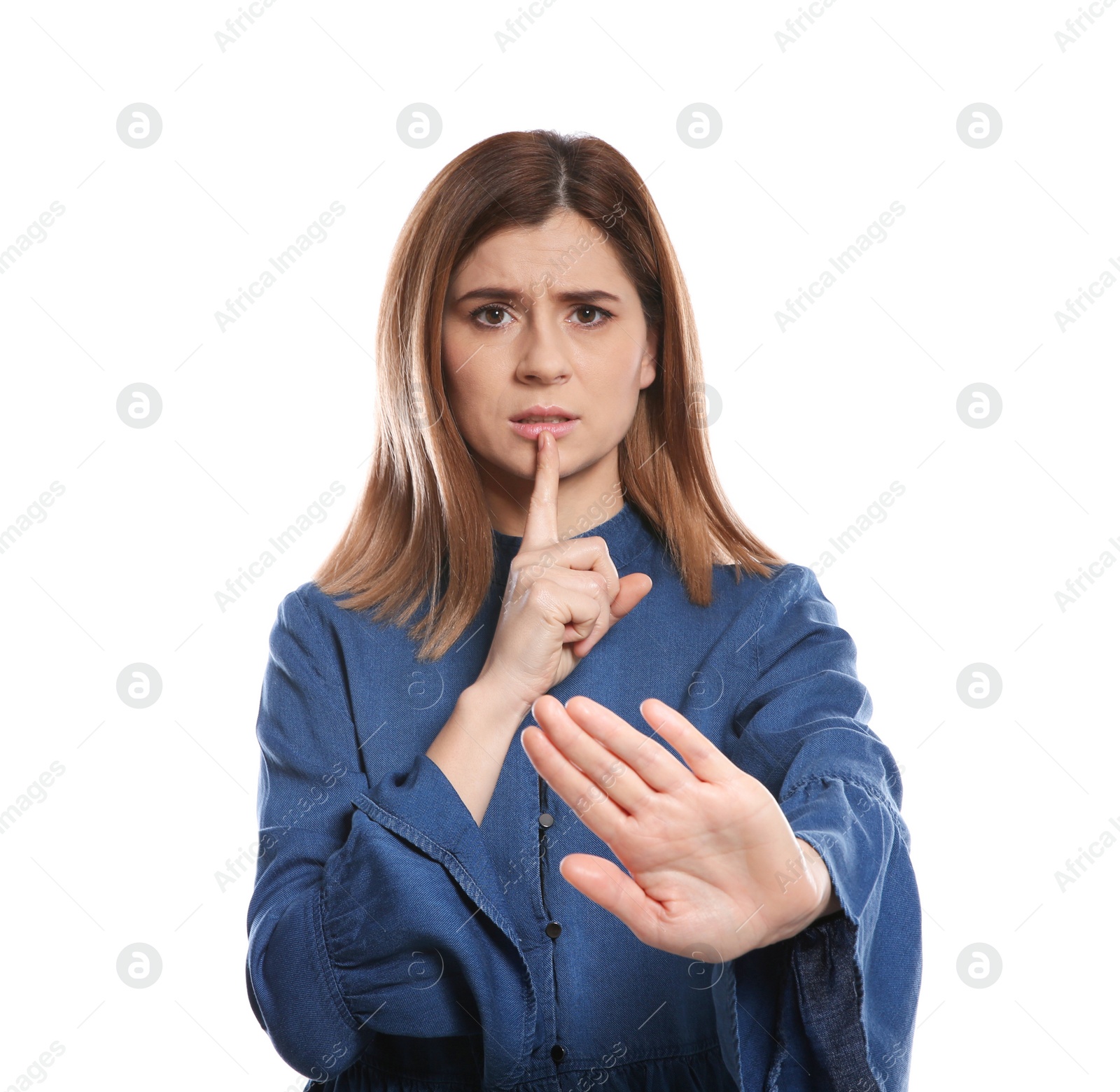 Photo of Woman showing HUSH gesture in sign language on white background