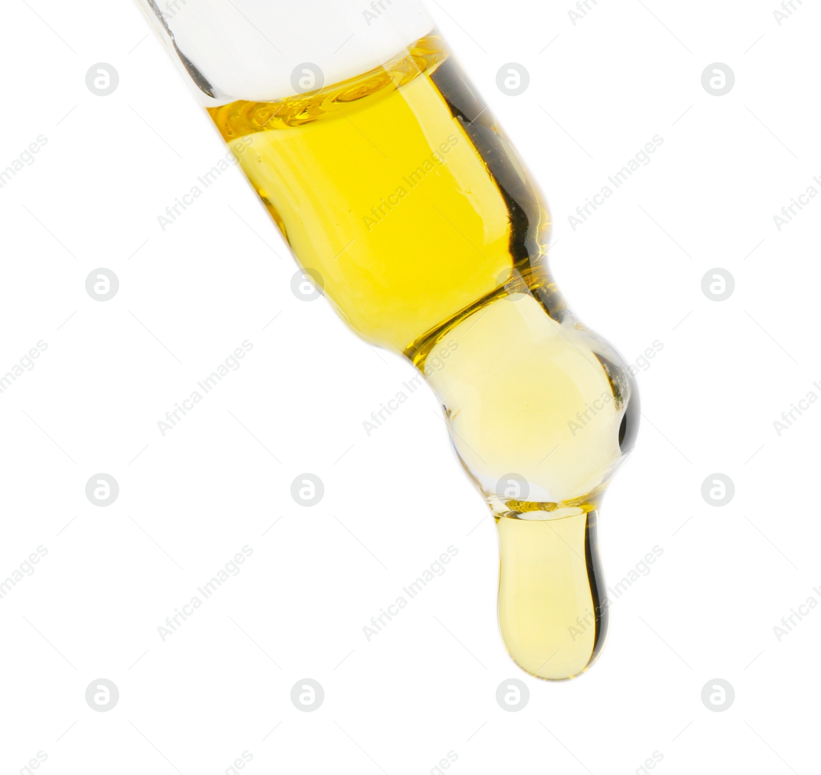 Photo of Dripping tincture from pipette isolated on white