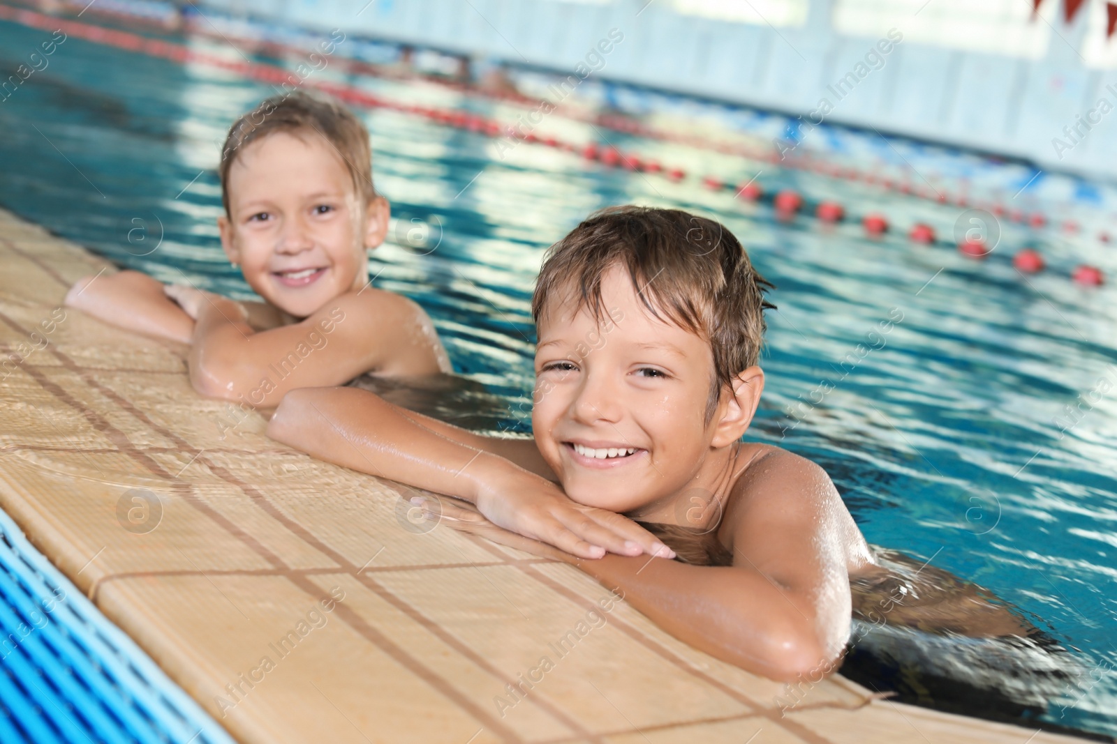 Photo of Cute little boys in indoor swimming pool