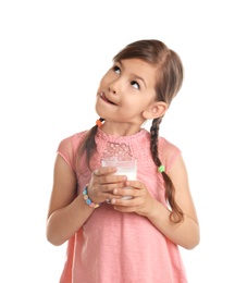 Cute little girl with glass of milk on white background