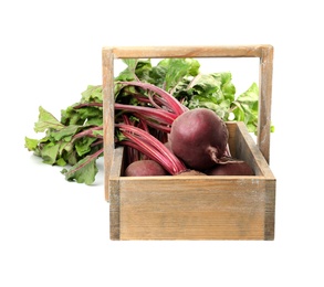 Photo of Raw ripe beets in wooden basket isolated on white
