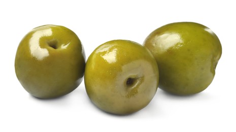 Photo of Three fresh green olives on white background