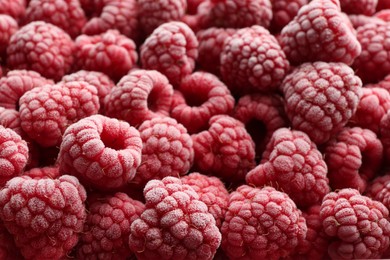 Tasty frozen raspberries as background, closeup view