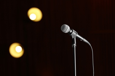 Photo of Microphone against festive lights, space for text