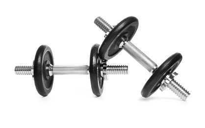 Photo of Professional dumbbells on white background. Sporting equipment