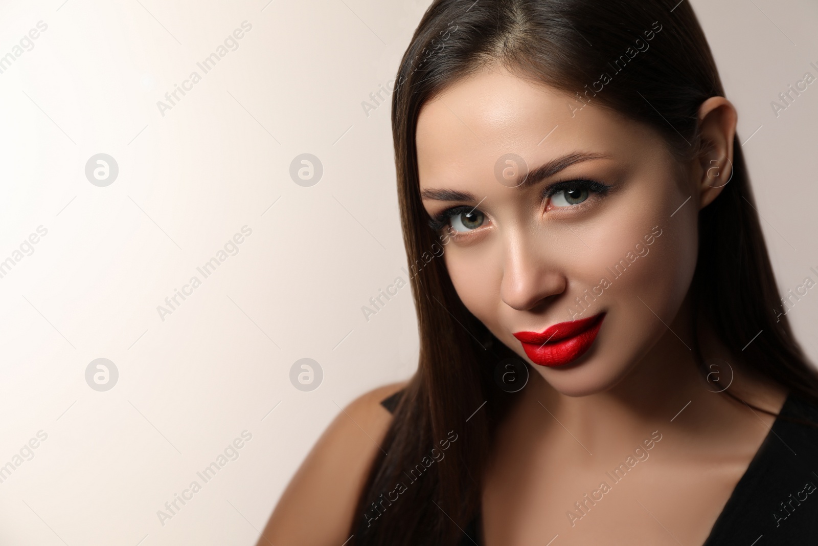 Photo of Beautiful woman with red lipstick on light background, space for text