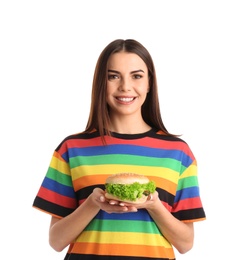 Photo of Young woman with tasty burger on white background