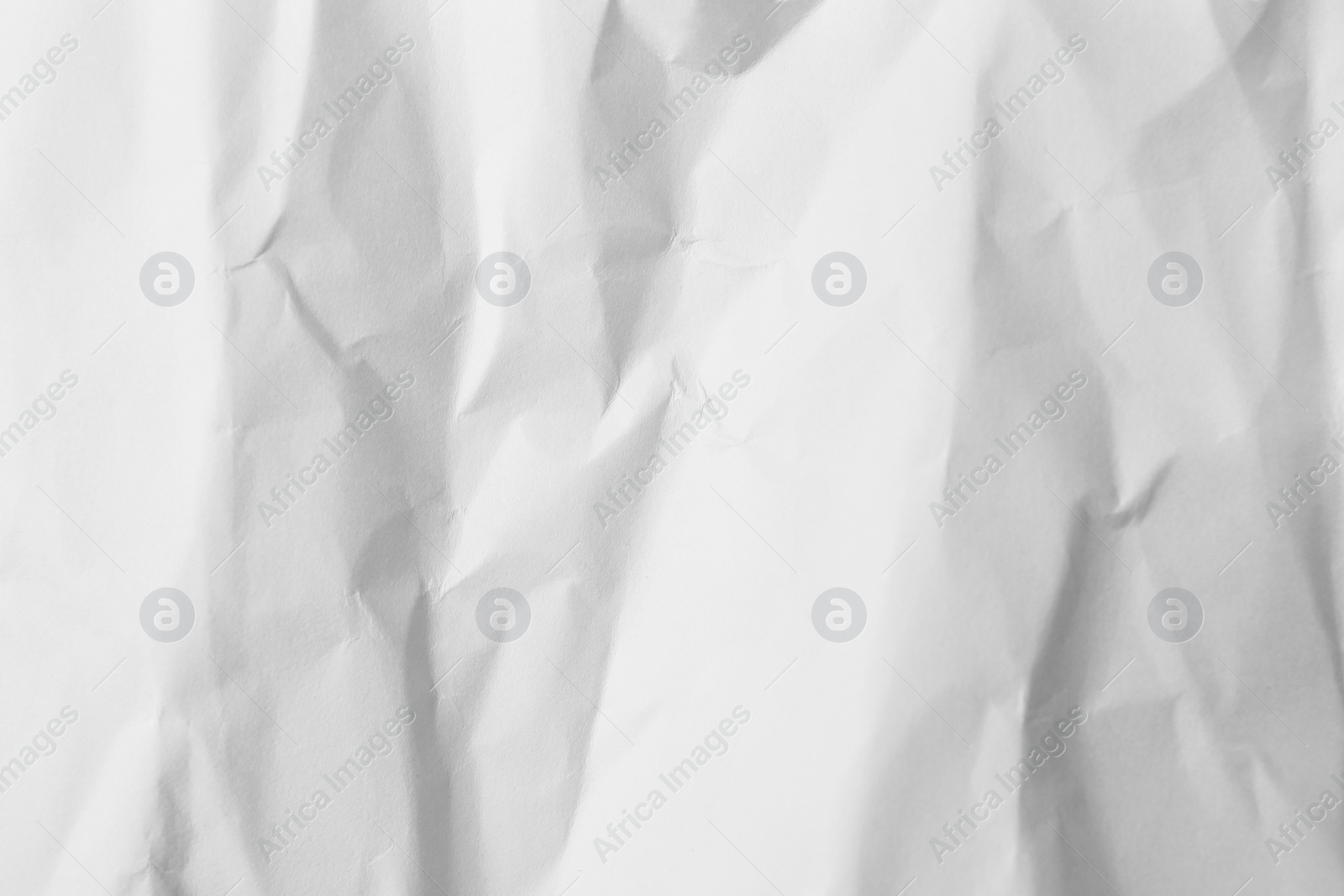 Photo of Sheet of crumpled lilac paper as background, top view