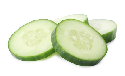 Photo of Slices of fresh cucumber on white background