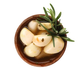 Photo of Bowl with preserved garlic and rosemary on white background, top view