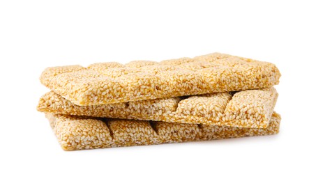 Photo of Tasty sesame kozinaki bars on white background