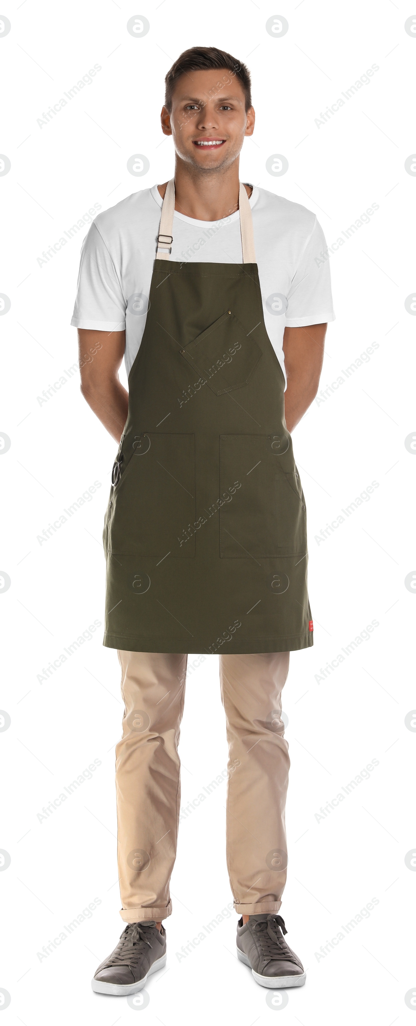 Photo of Full length portrait of happy young waiter in uniform on white background