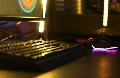 Playing video games. Computer keyboard on table