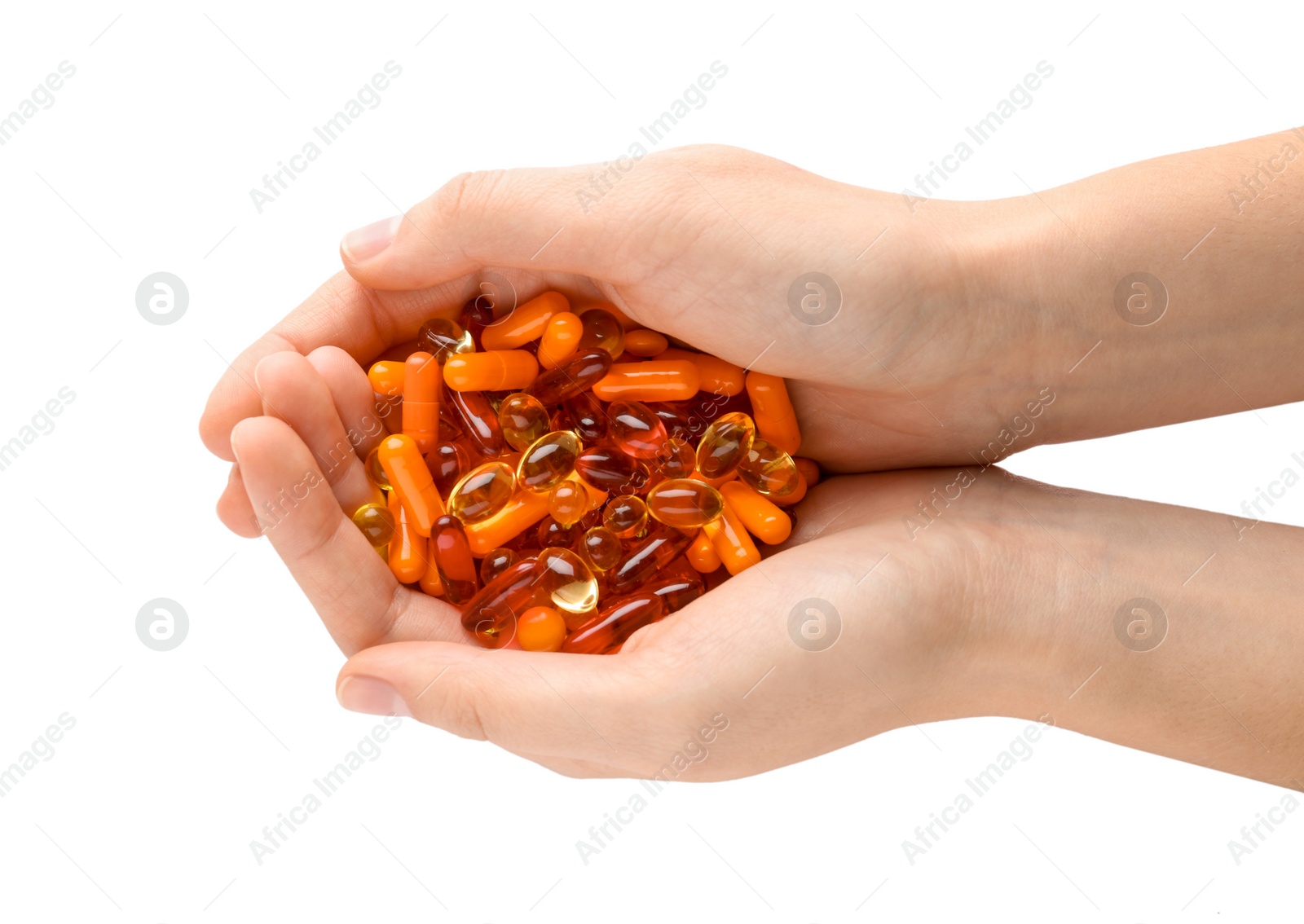 Photo of Woman holding color pills on white background, closeup