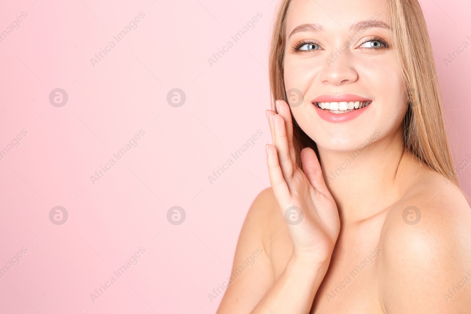Photo of Portrait of beautiful young woman with natural makeup on color background. Space for text