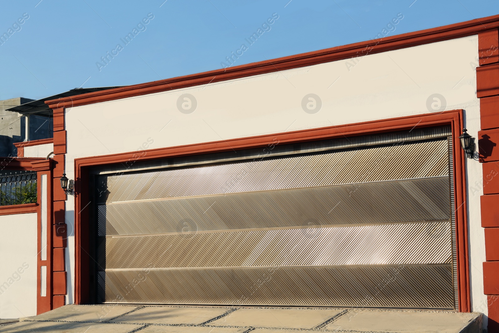 Photo of Garage building with closed sectional metal gate