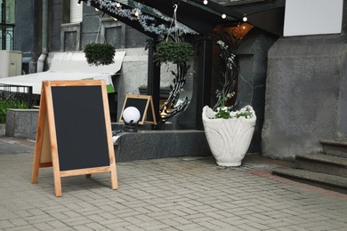 Blank advertising board on city street. Space for design