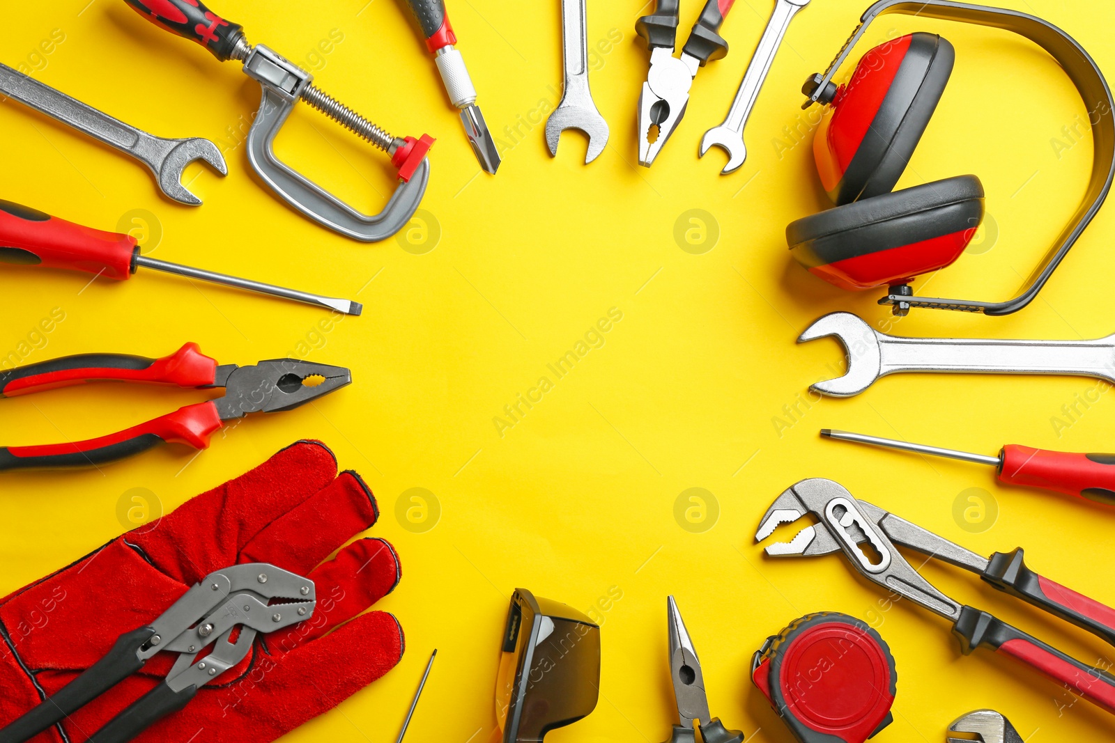 Photo of Flat lay composition with construction tools on color background, space for text