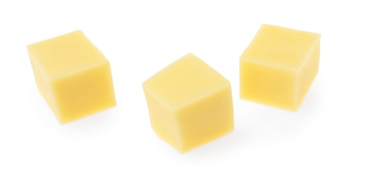 Photo of Cubes of tasty cheese isolated on white