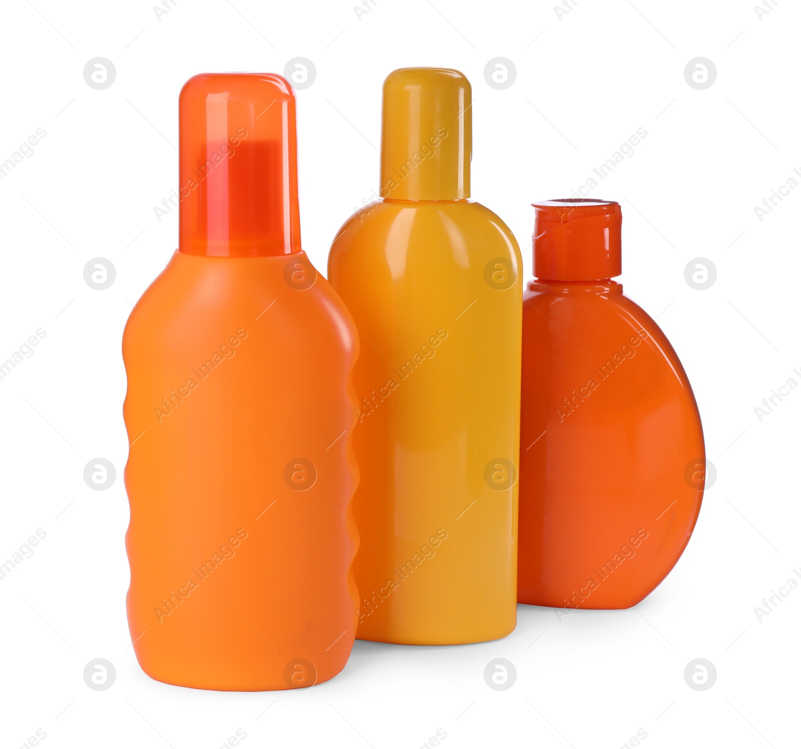 Photo of Bottles with sun protection products isolated on white