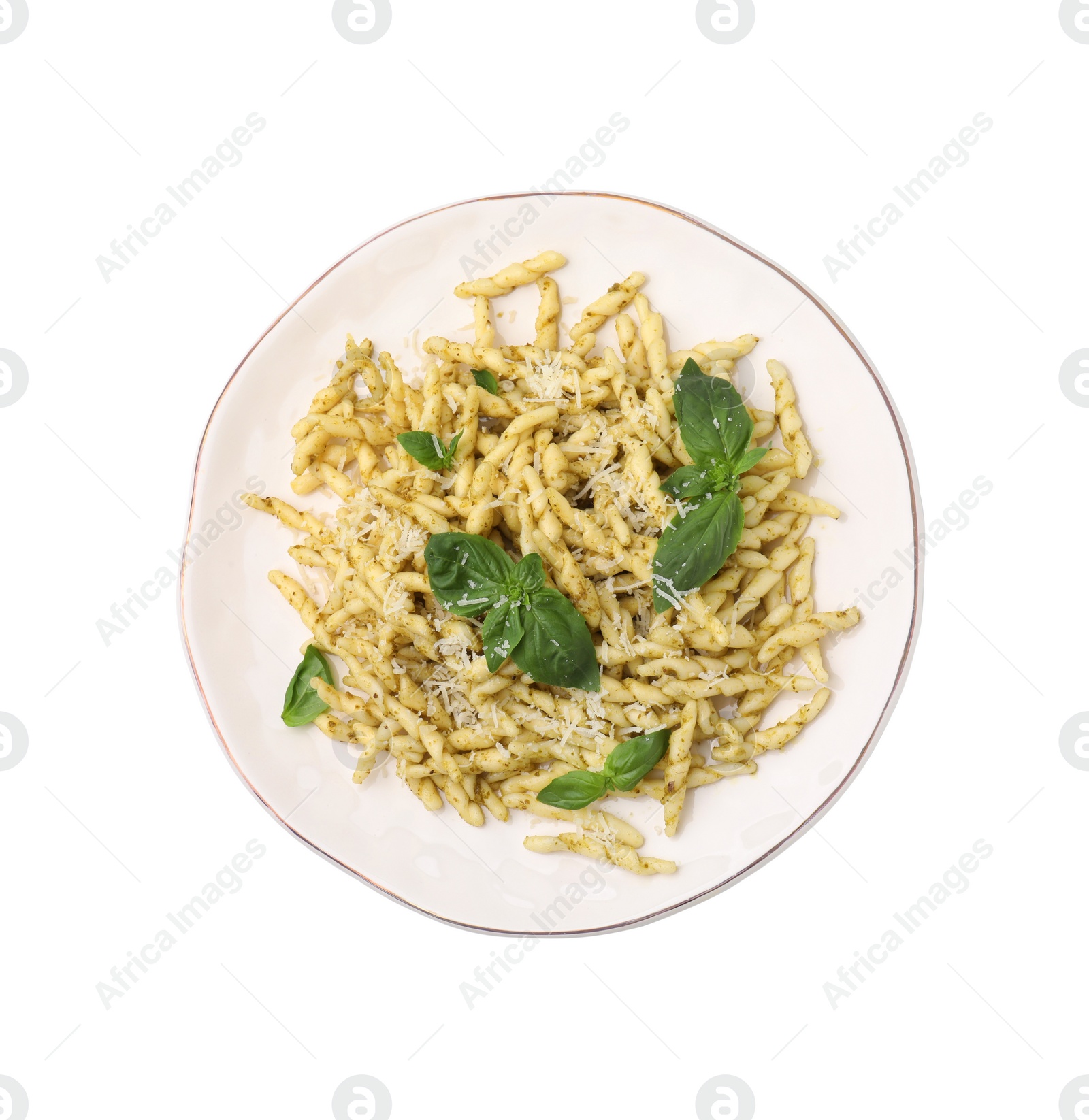 Photo of Plate of delicious trofie pasta with pesto sauce, cheese and basil leaves isolated on white, top view